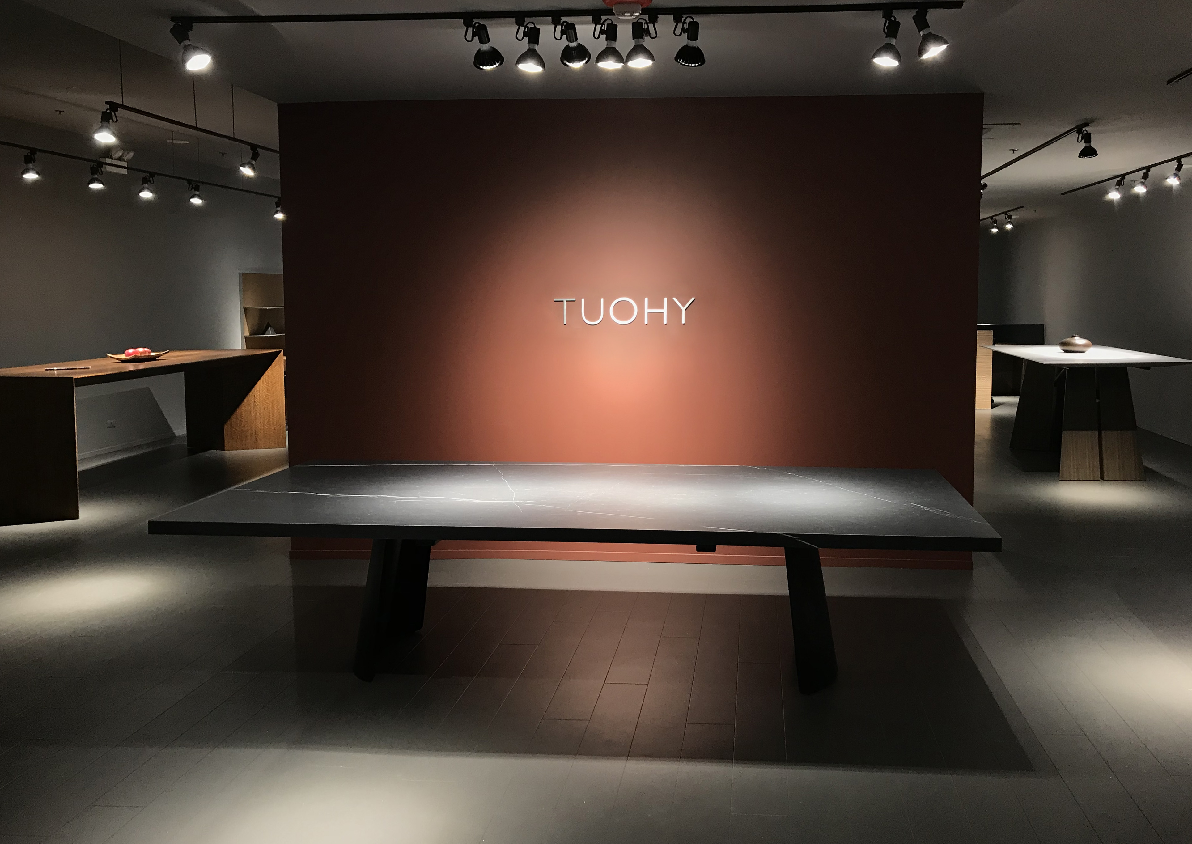 Entrance to TUOHY showroom, showing Duende Table (design: Metrica) with porcelain surface by Florim.